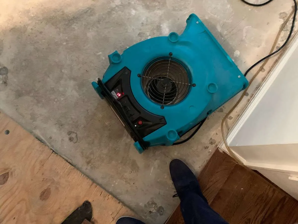 Air mover drying subfloor during Commercial Water Damage Restoration in Fort Riley
